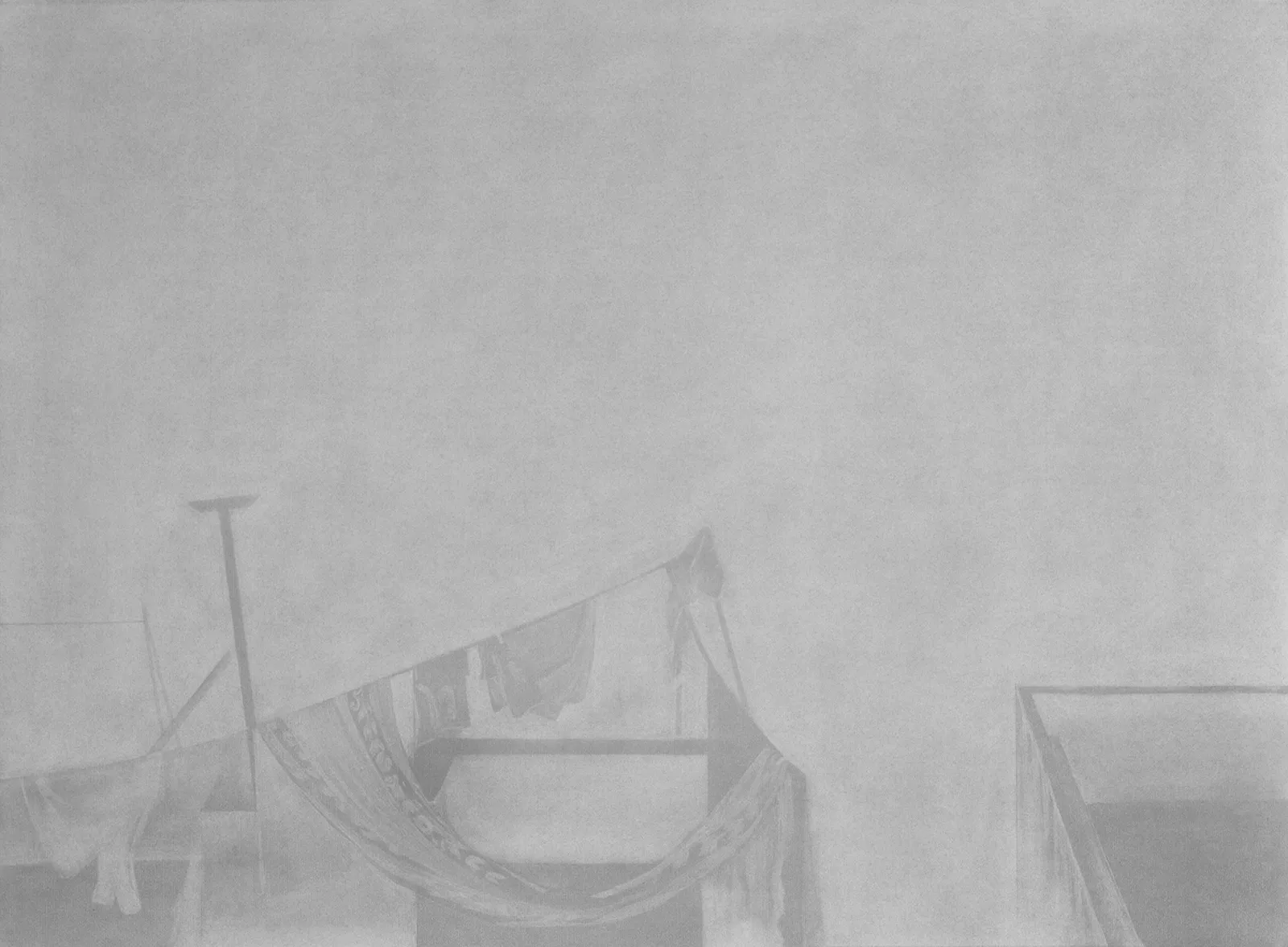 Graphite drawing of a rooftop with hanging cloth and architectural fragments fading into a light grey haze.