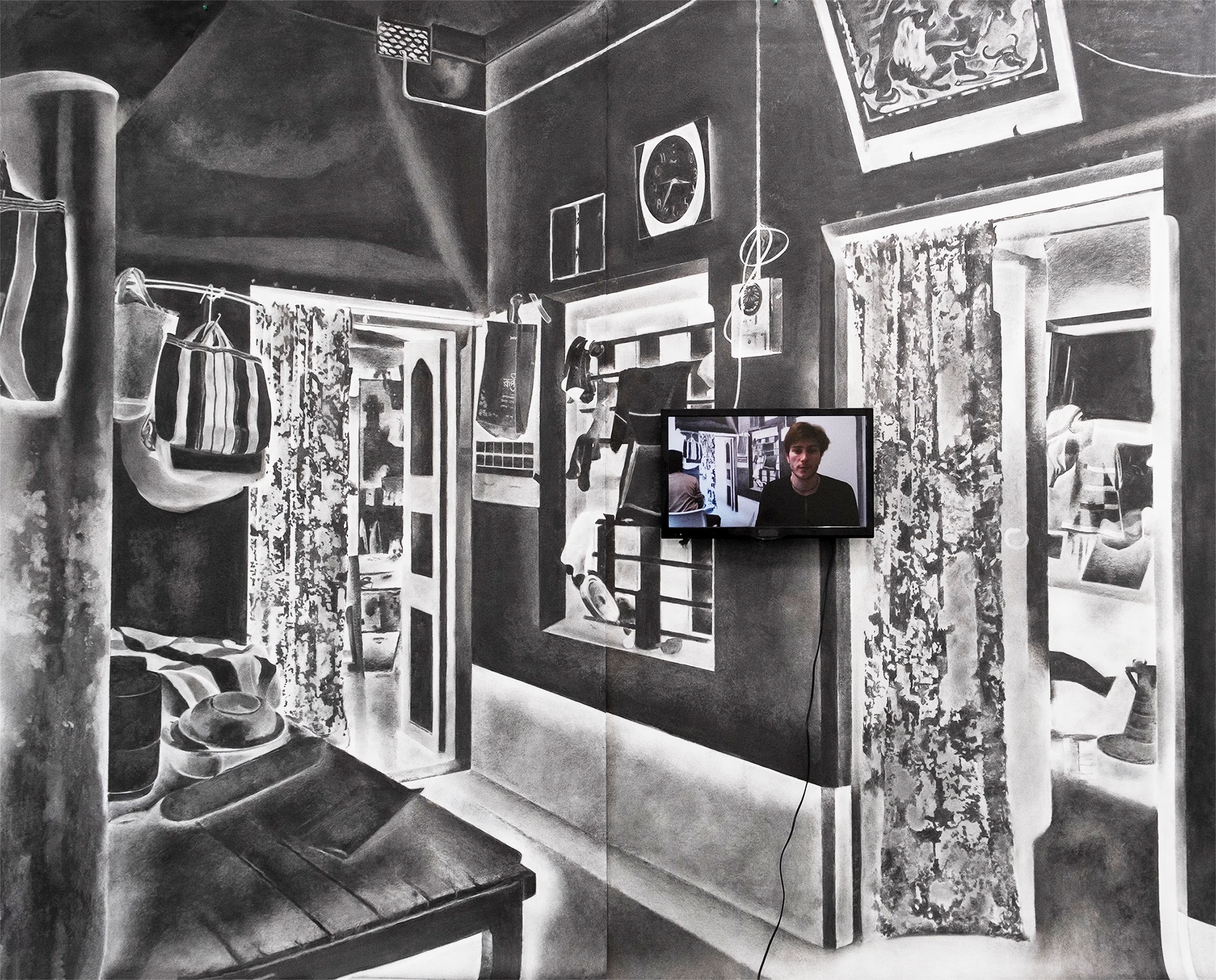 Aniruddha Biswas, Turning Back, 2023, large charcoal drawing of a domestic interior with reversed tonal values and an integrated video screen.